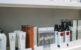 A variety of skincare and beauty products displayed neatly on store shelves.